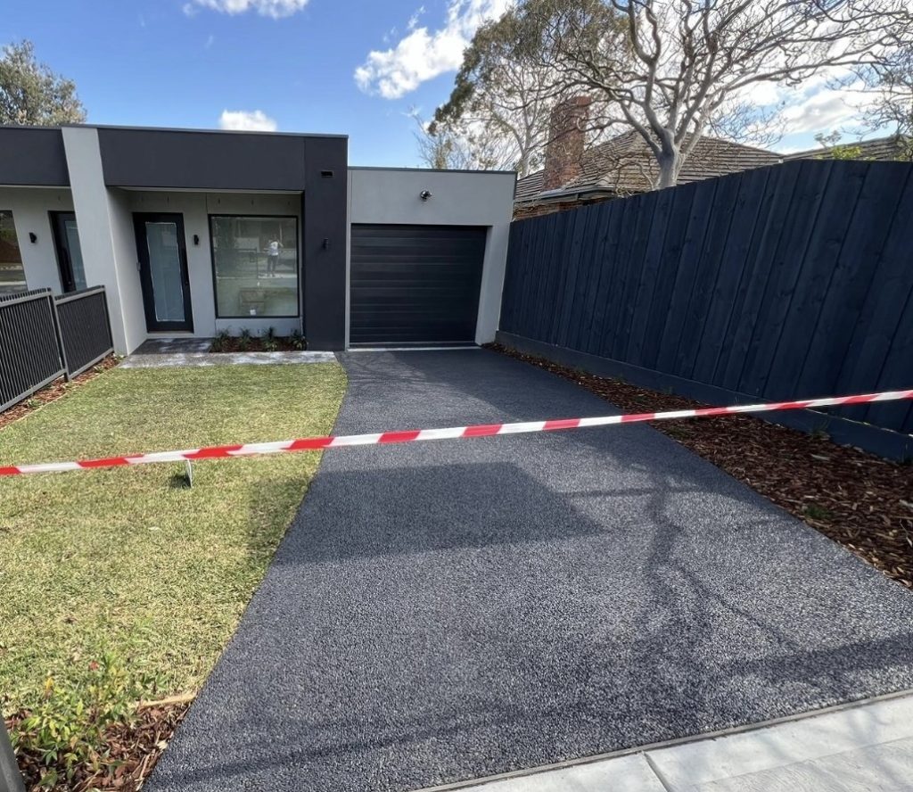 Charcoal exposed aggregate driveway in Melbourne by Cretex Concreting