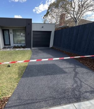 Charcoal exposed aggregate driveway in Melbourne by Cretex Concreting